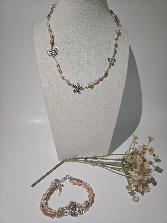 Seashell Necklace with beige seashells and floral and turtle-shaped metal charms, view 2