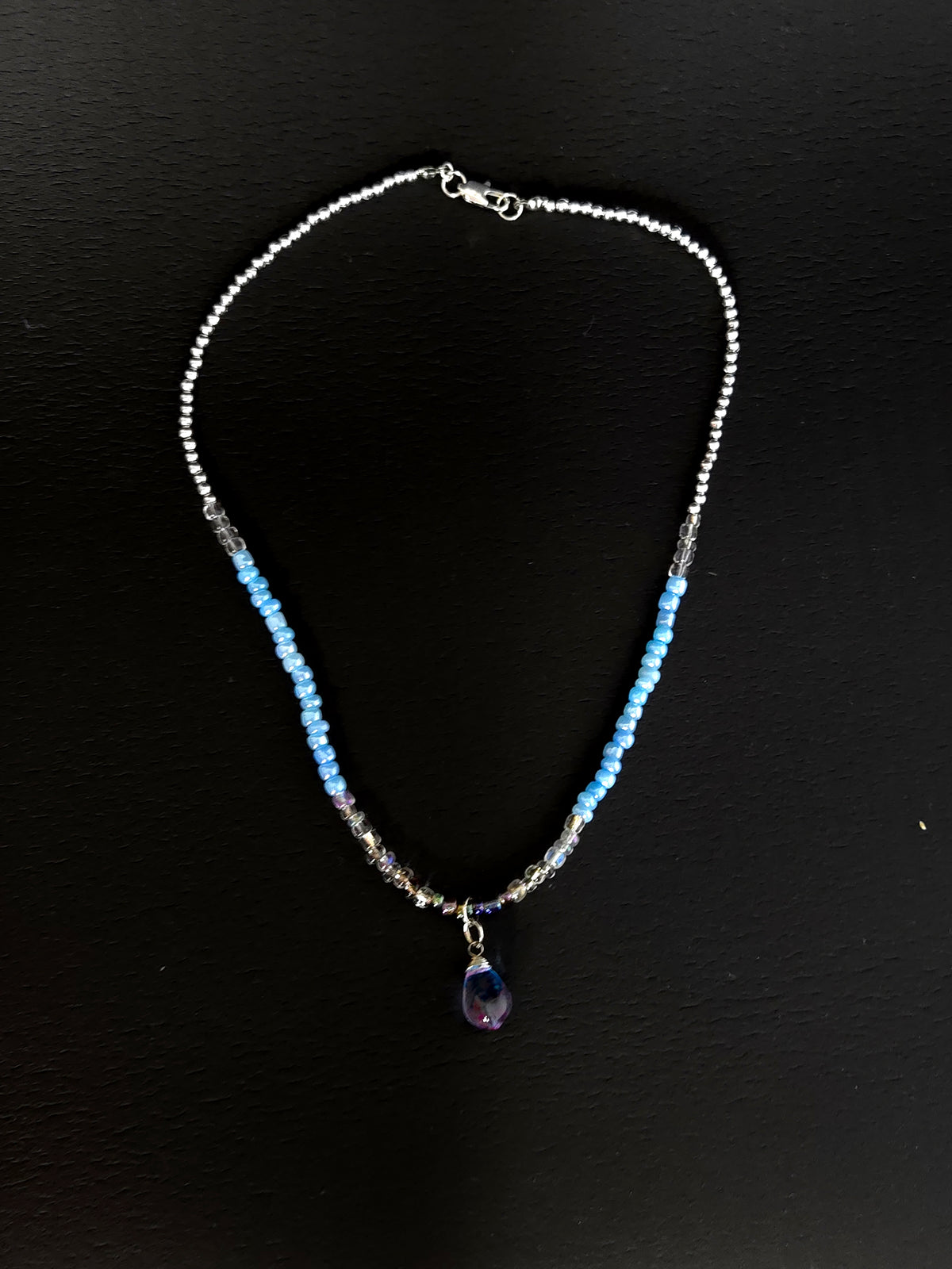 Blue Teardrop Necklace with clear-to-blue glass beads and a blue-violet teardrop pendant, view 2