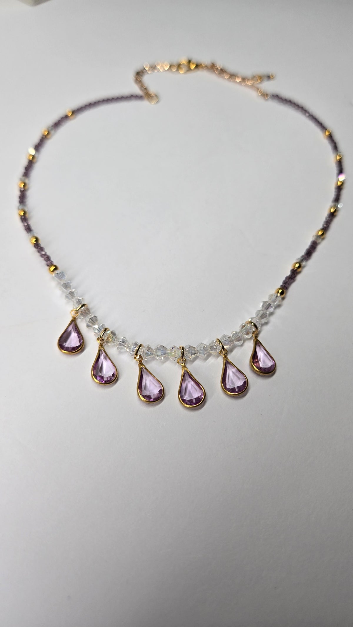 Lavender Drops Necklace with seven lavender teardrop drops on purple and clear beads, view 2