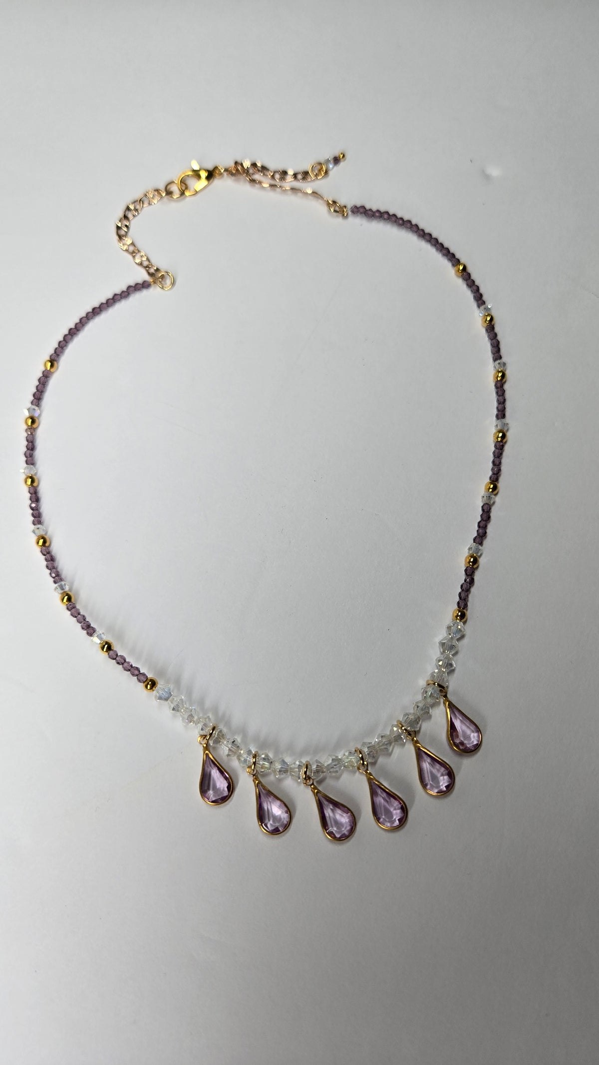 Lavender Drops Necklace with seven lavender teardrop drops on purple and clear beads, view 3