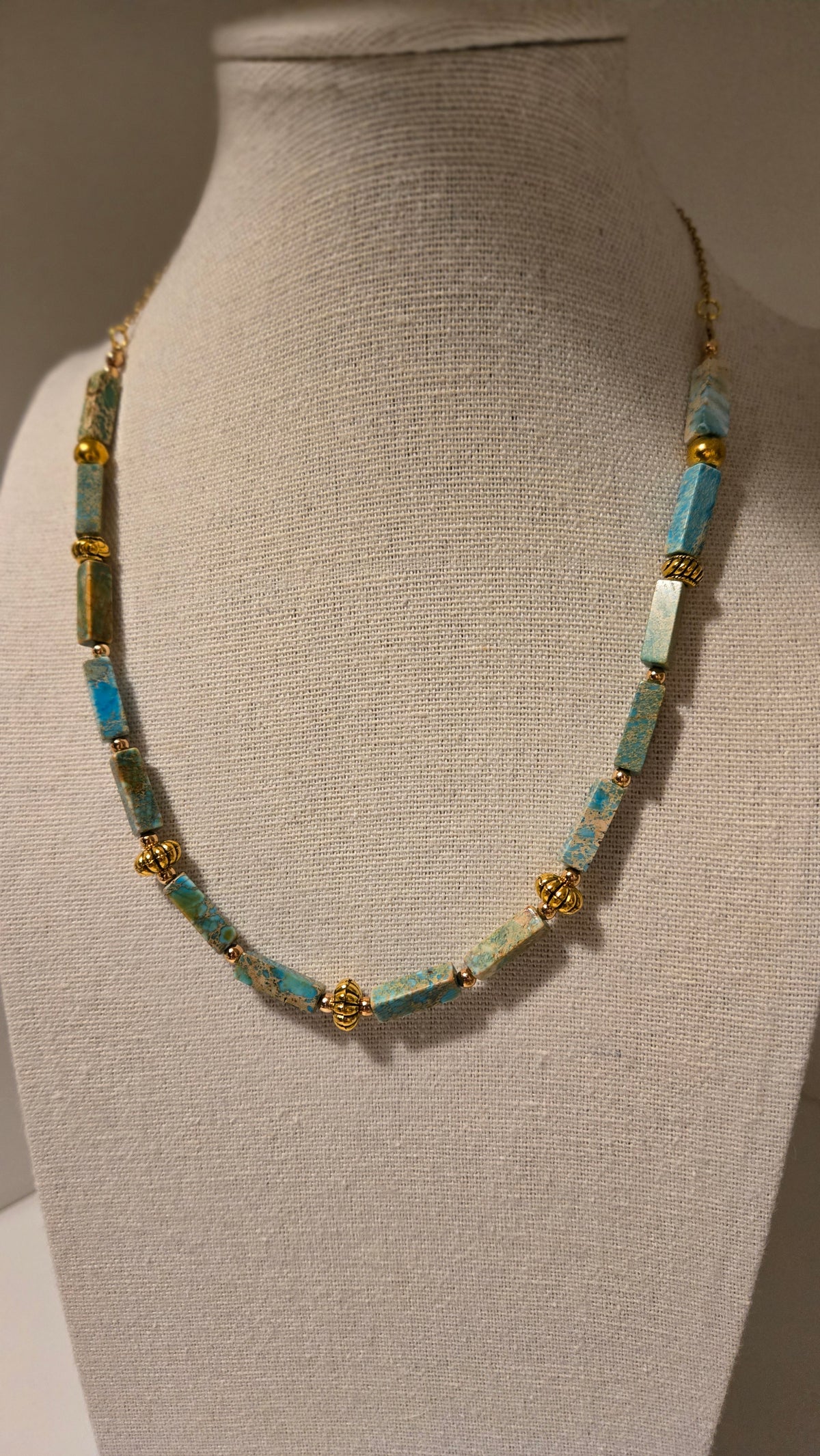 Ocean Whisper Necklace of turquoise-blue rectangular beads with gold-tone spacers, view 8