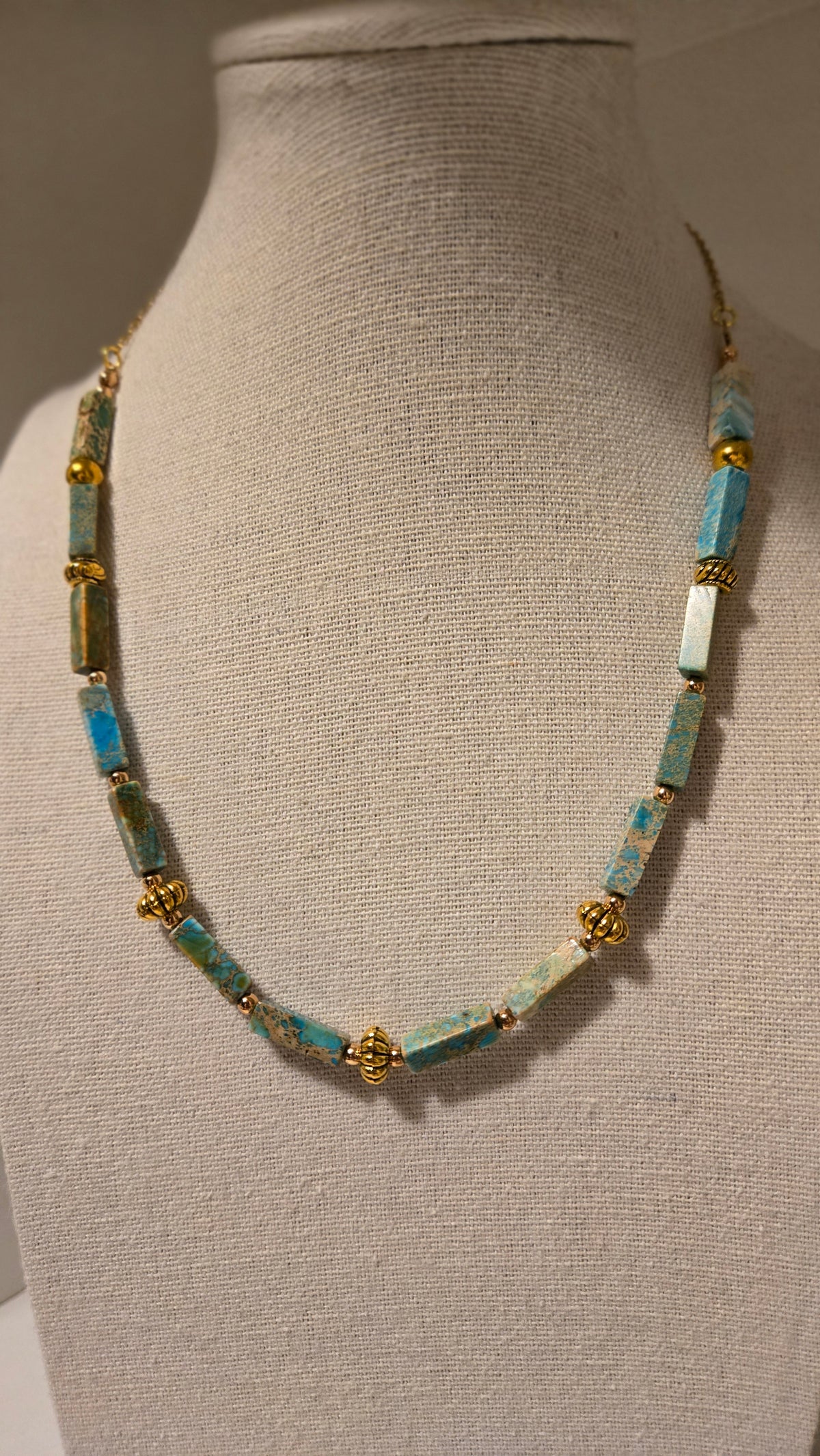 Ocean Whisper Necklace of turquoise-blue rectangular beads with gold-tone spacers, view 9