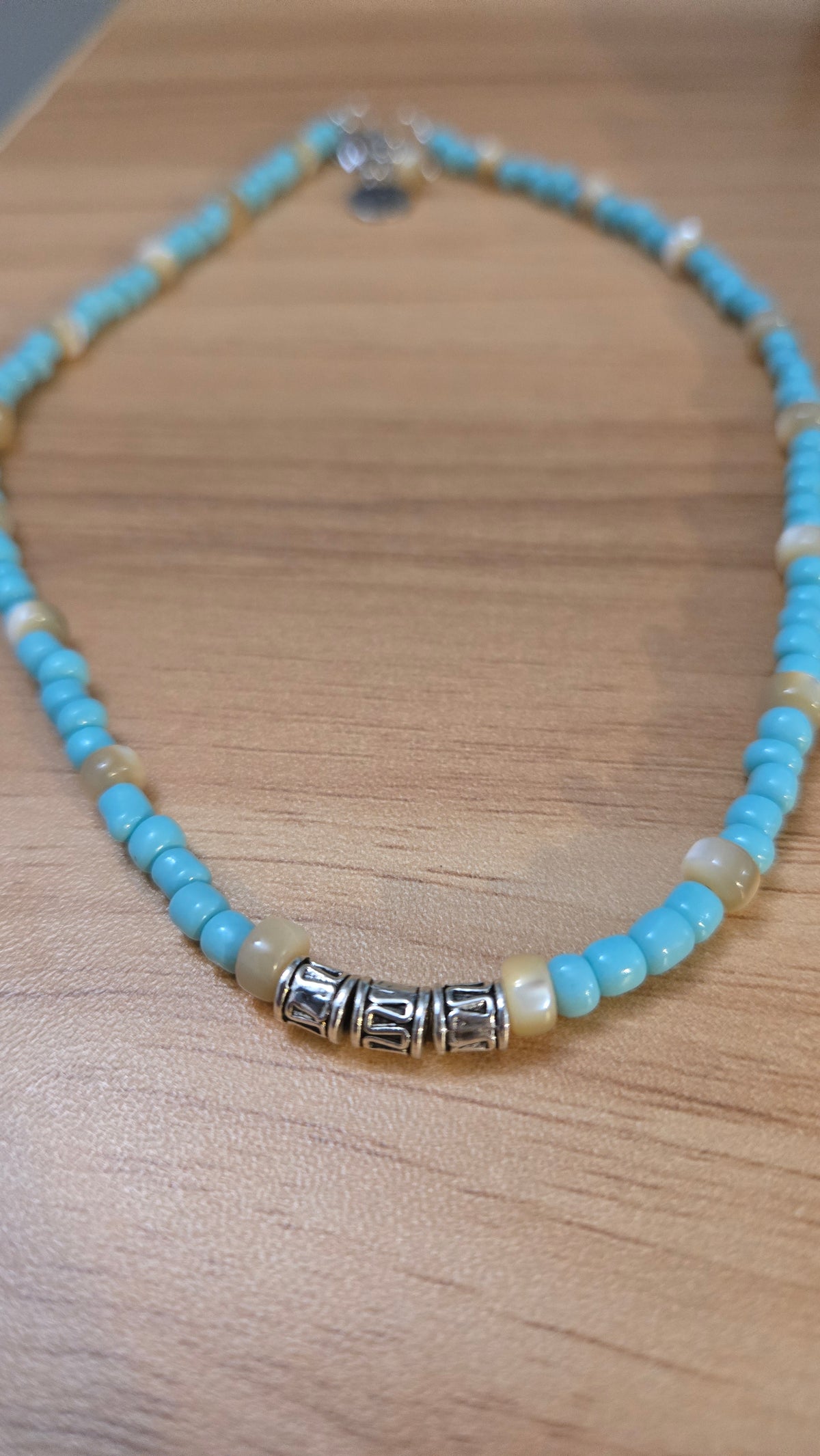 Sea Breeze Necklace with turquoise and ivory beads and silver details, view 2