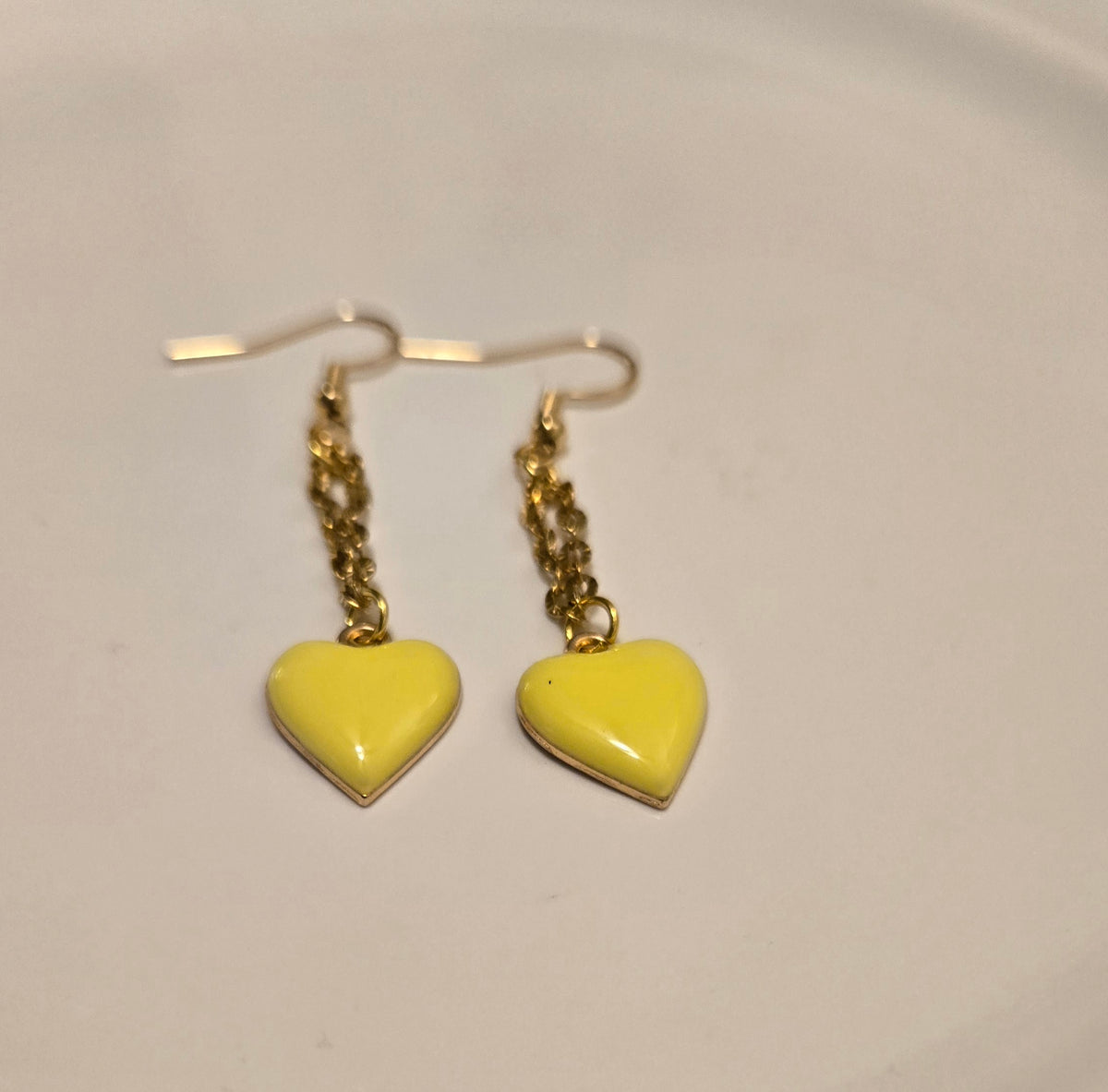 Sunshine Heart Earrings with yellow heart charms on gold-tone chains, view 3