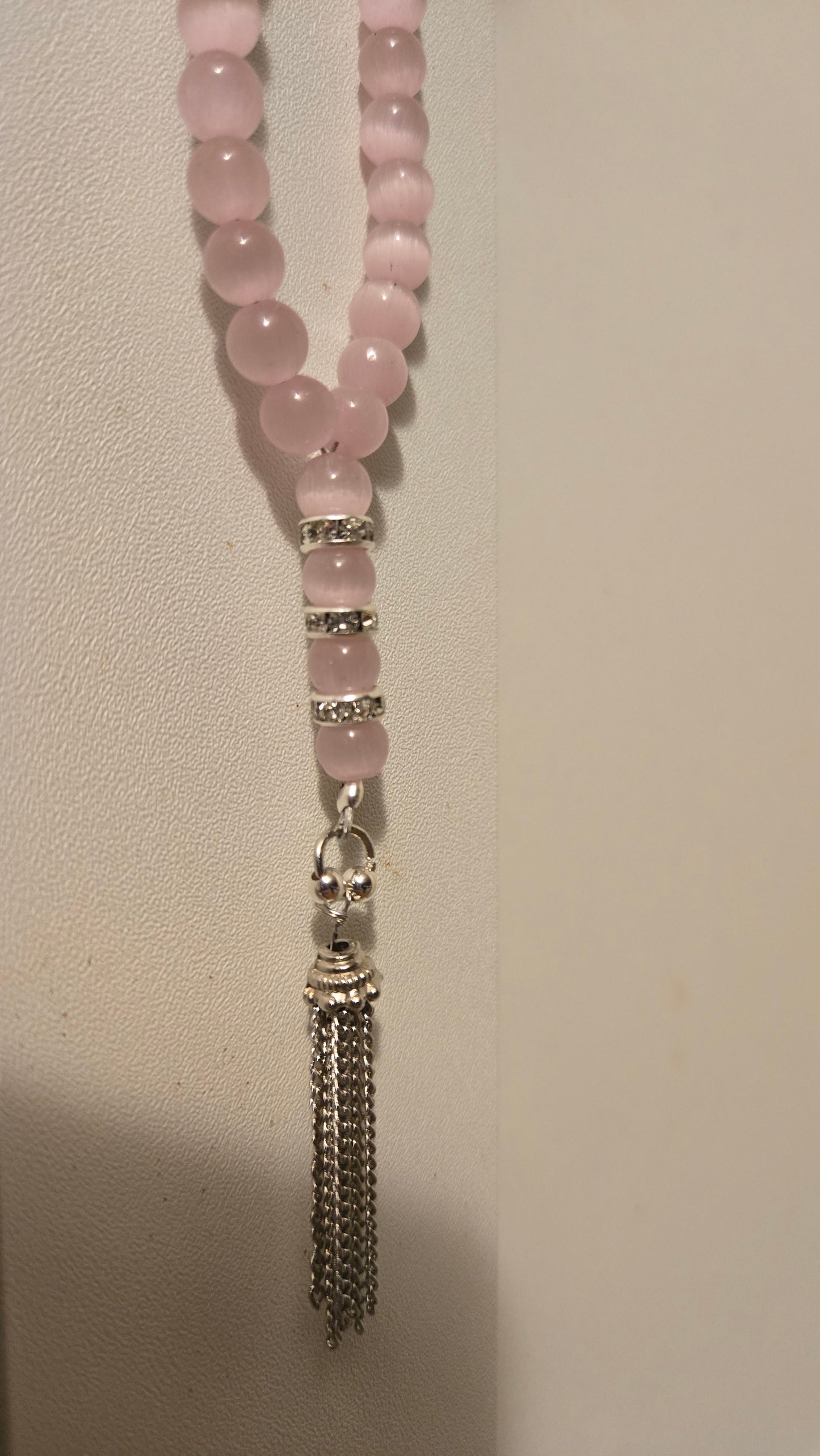Blush Serenity Tasbih on a serene backdrop, evoking calm and spiritual reflection