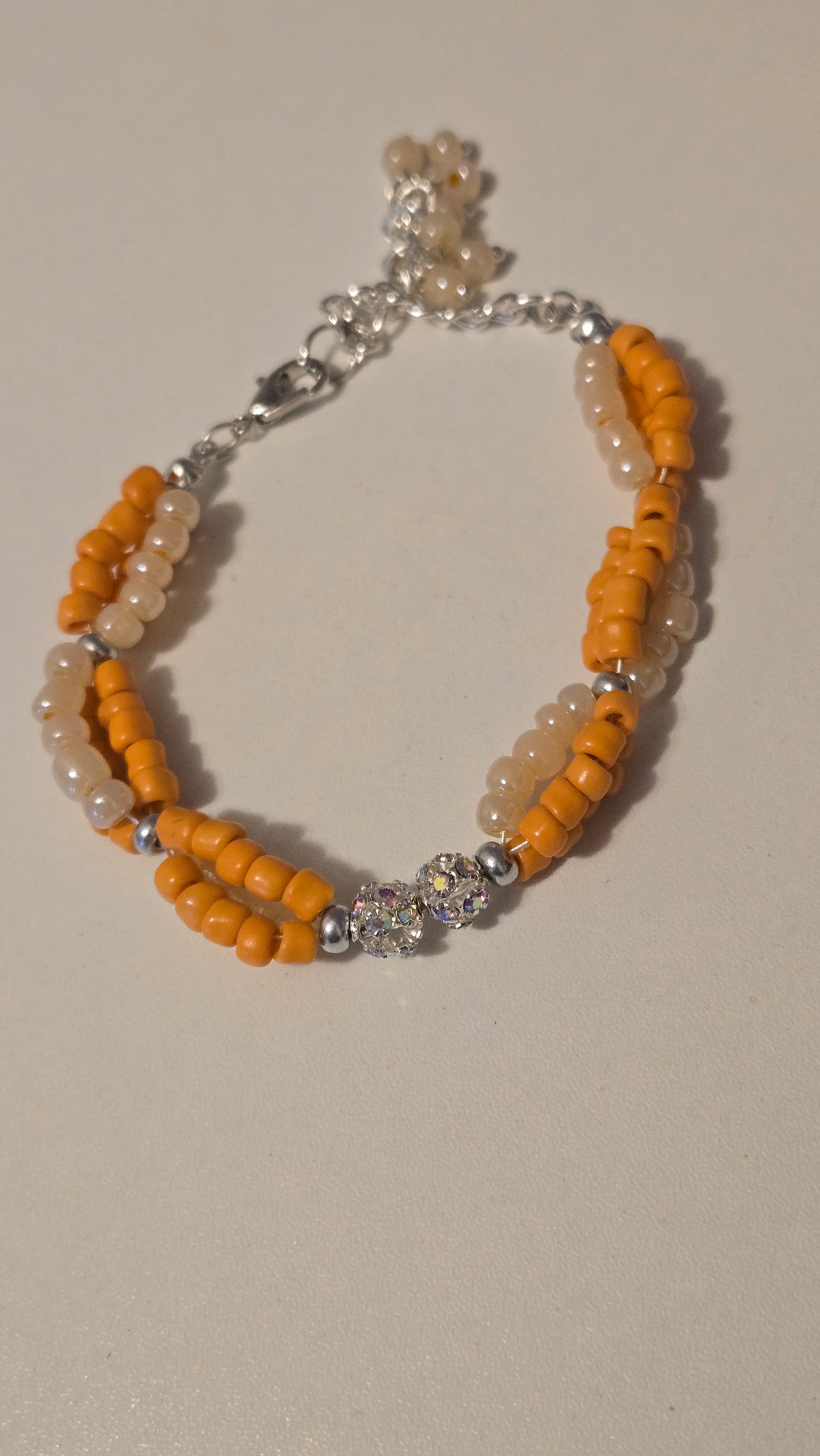 Coral Sun Bracelet with orange and ivory glass beads and crystal accents, view 4