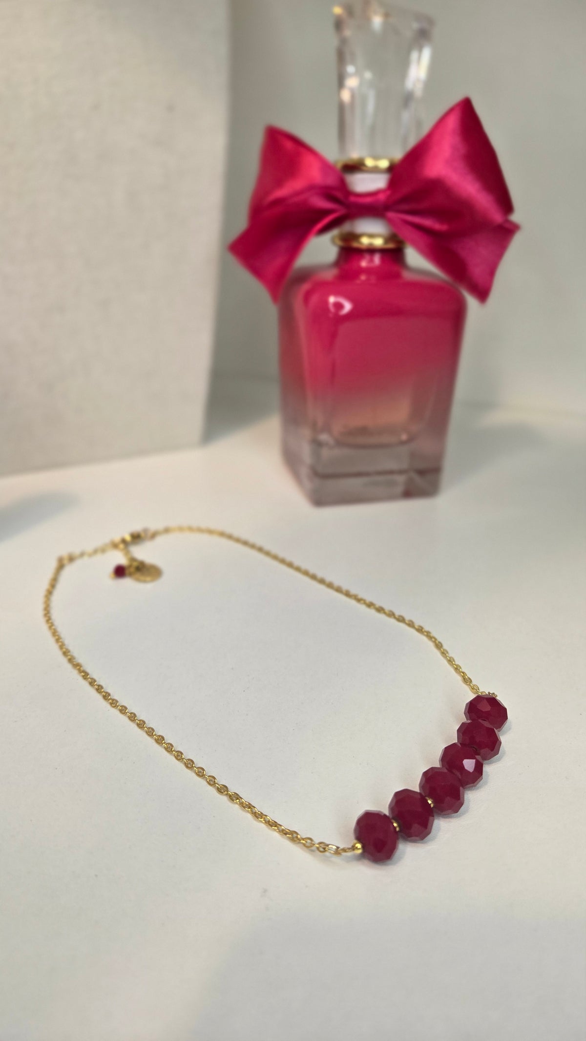 Ruby Crystal Chain Necklace with faceted ruby-red crystal beads on a gold-tone chain, view 2