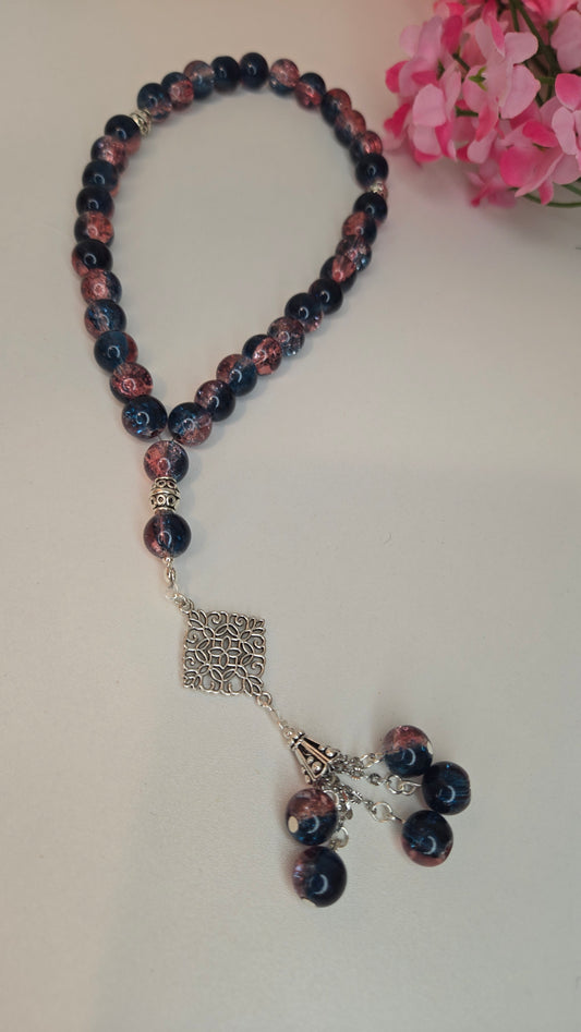 Midnight Bloom Prayer Beads with blue and rose marbled beads and an ornate charm, view 2