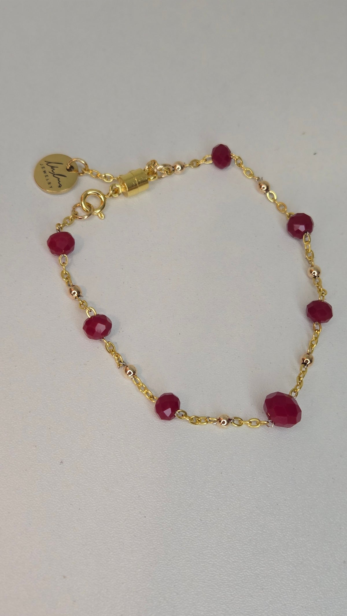 Ruby Chain Glow Bracelet with ruby-red crystal beads on a gold-tone chain