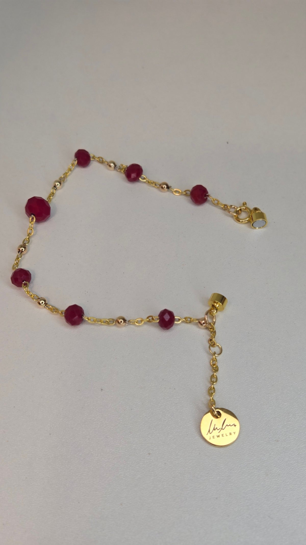 Ruby Chain Glow Bracelet with ruby-red crystal beads on a gold-tone chain, view 10