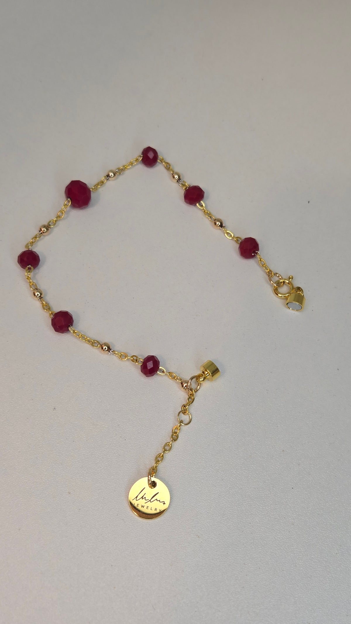 Ruby Chain Glow Bracelet with ruby-red crystal beads on a gold-tone chain, view 11
