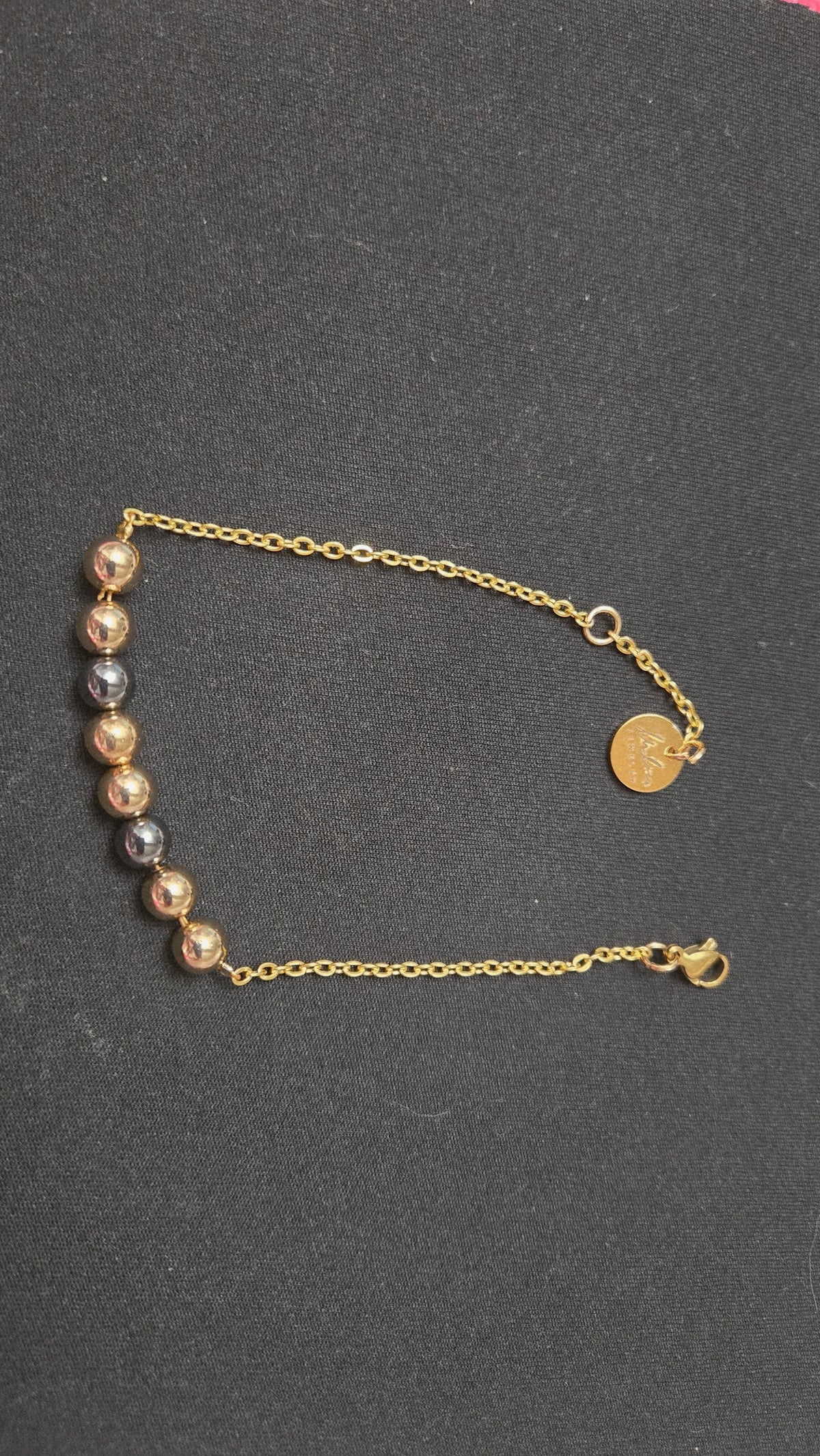Mixed-Tone Bracelet with gold-tone chain, metallic beads and a round charm