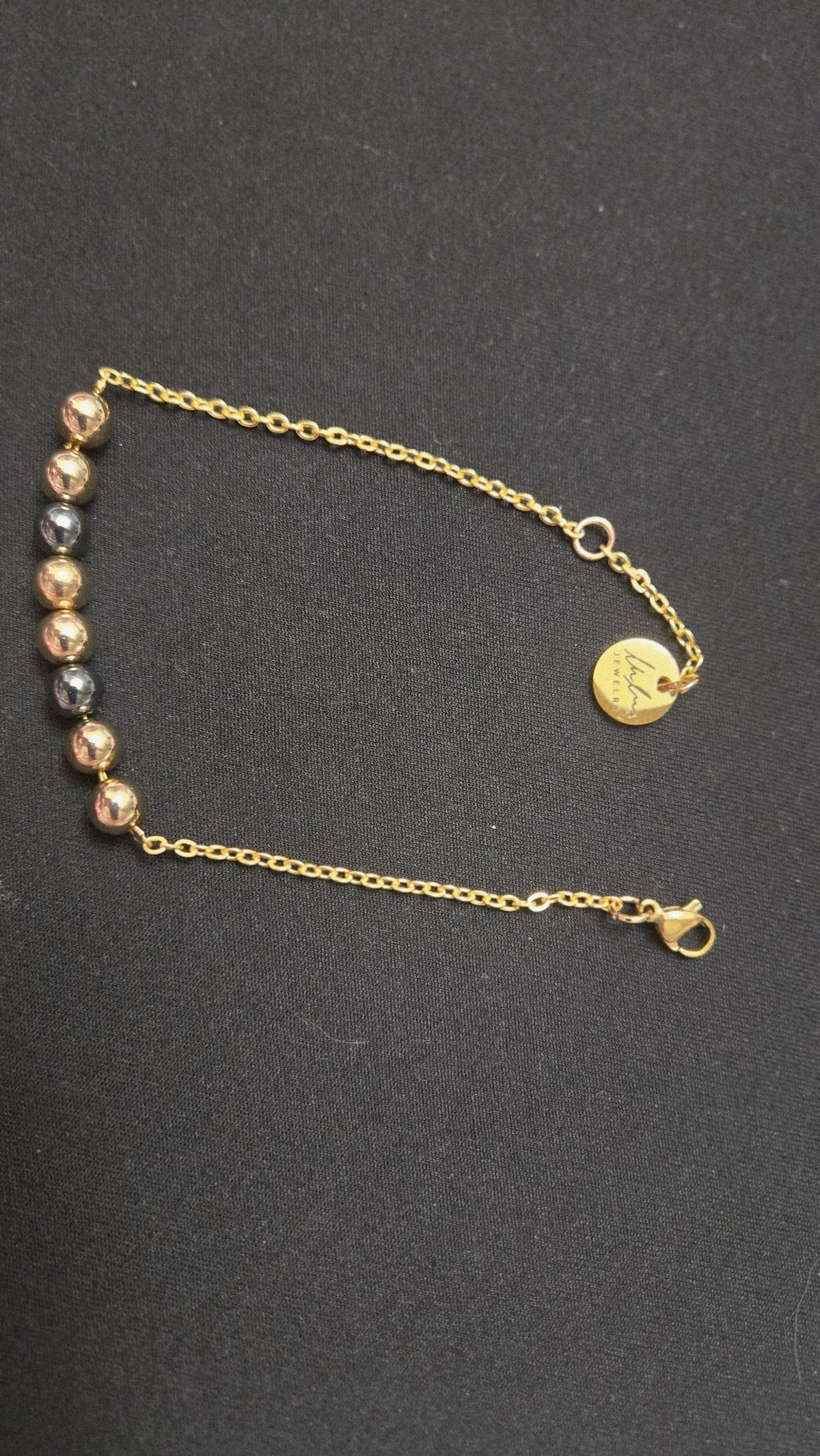 Mixed-Tone Bracelet with gold-tone chain, metallic beads and a round charm, view 4