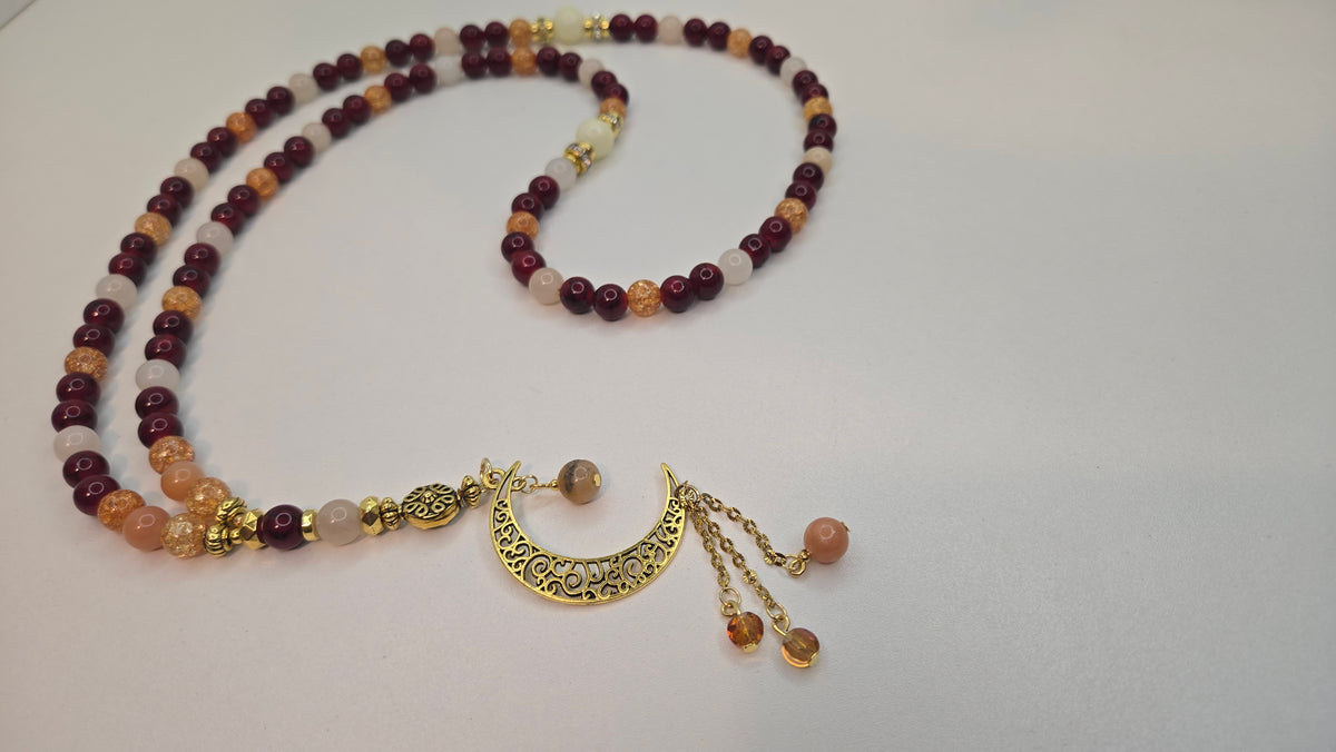 Golden Sunset Tasbih with red, orange and cream beads and a gold-tone crescent moon charm, view 2