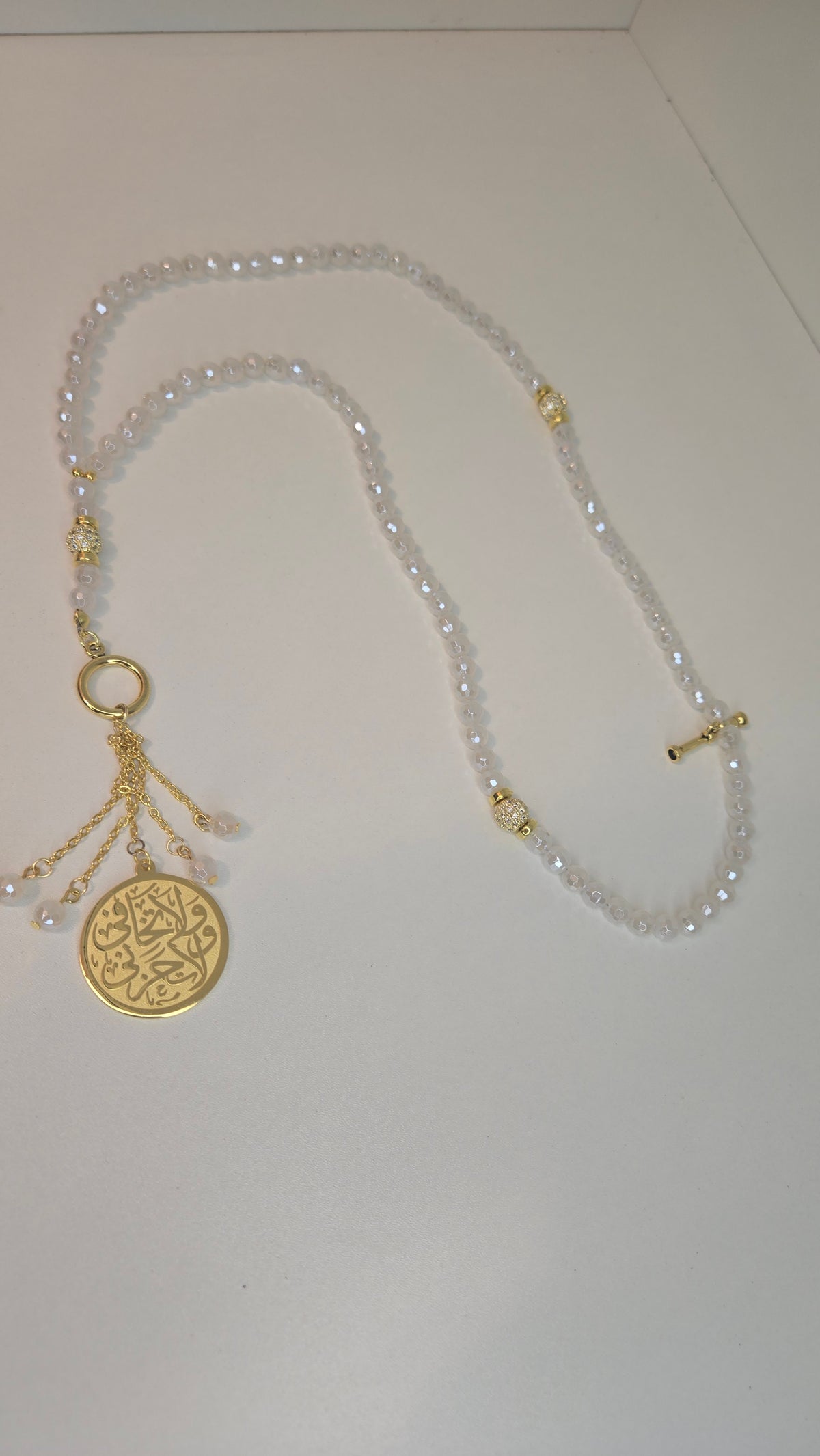 Mystic White Agate Tasbih with white agate beads and an Arabic calligraphy medallion