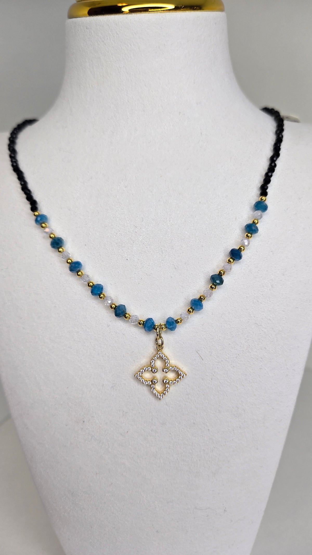 Azure Bloom Necklace with blue apatite stones, zircon accents and a zircon-studded pendant