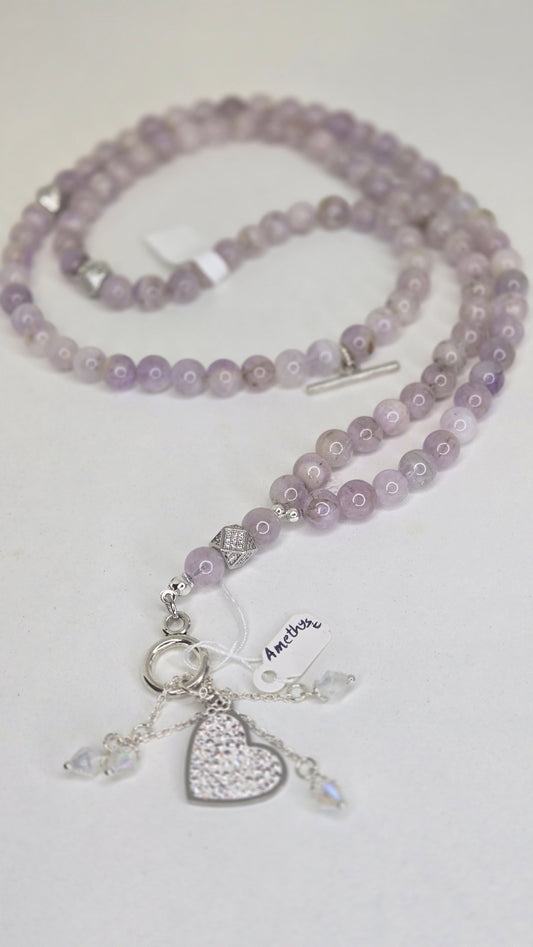 A luxurious tasbih crafted with elegant red jade stones and gold zircon-studded accents for a refined and sophisticated finish. The rich red tones combined with sparkling gold details create a timeless and graceful look.