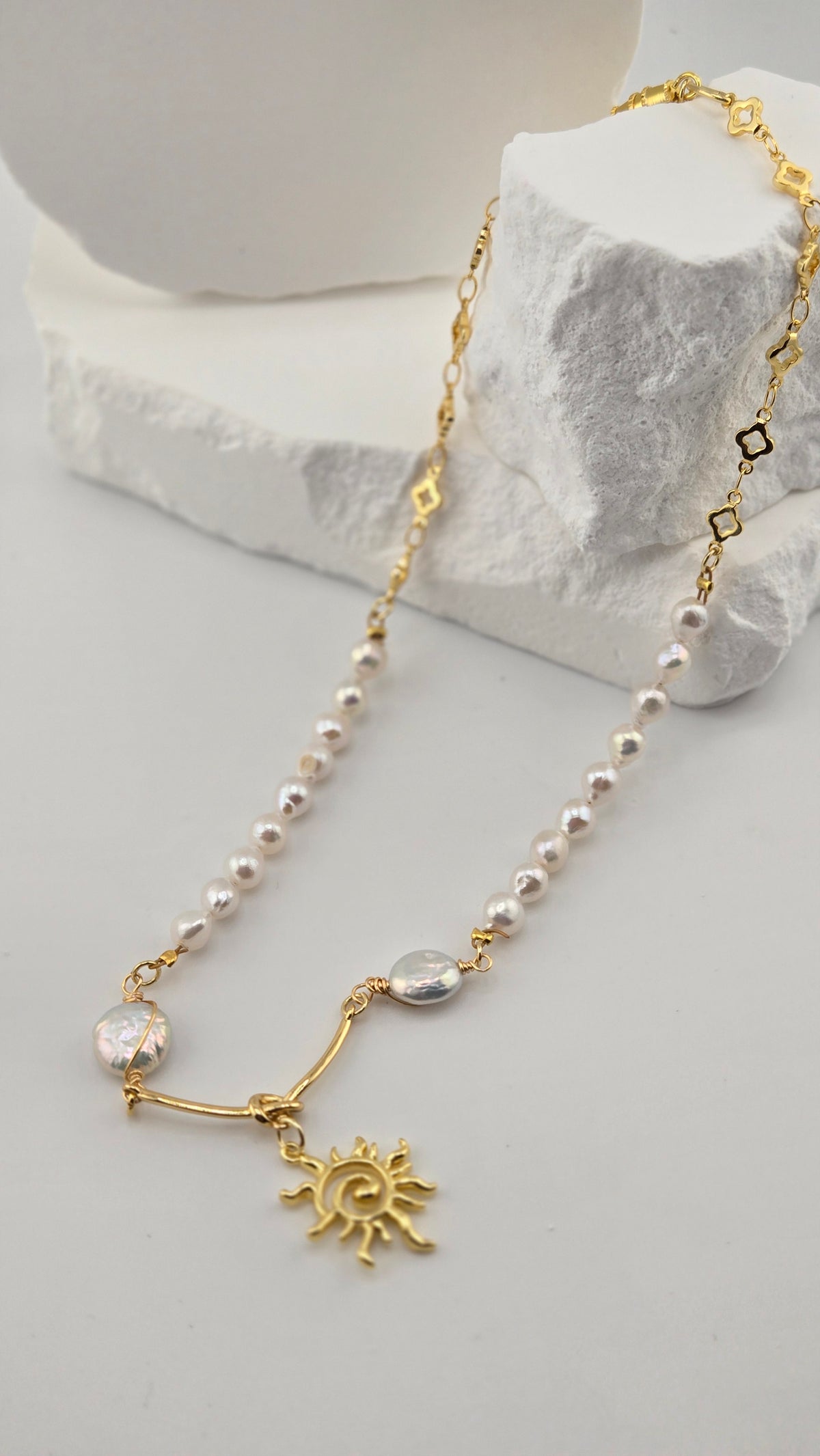 Pearl Radiance Necklace with irregular pearl beads, gold-tone chain and sun pendant