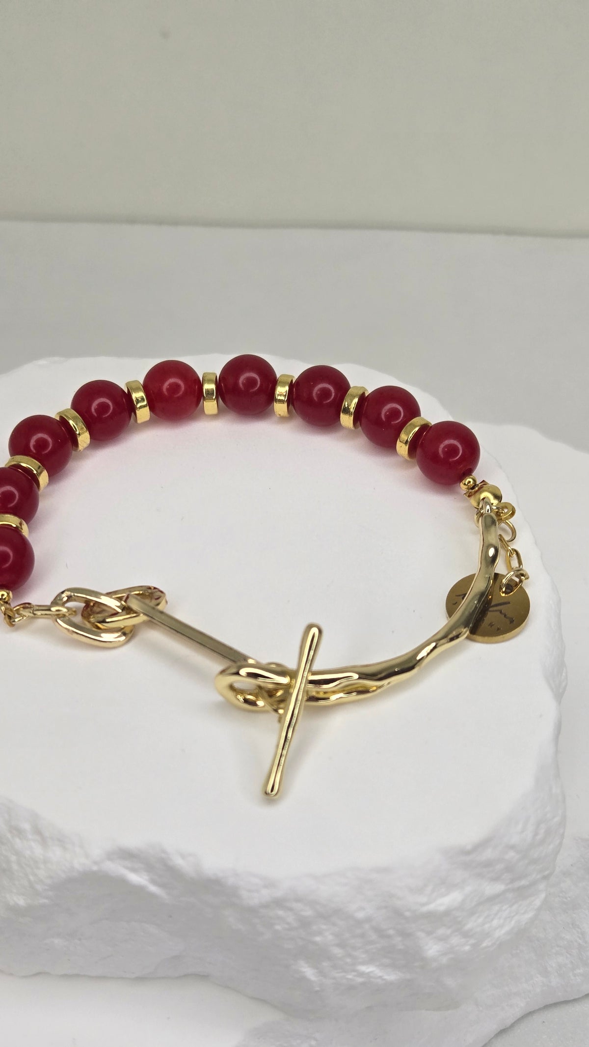 Crimson Glow Bracelet with red jade, gold-tone spacers and a toggle clasp