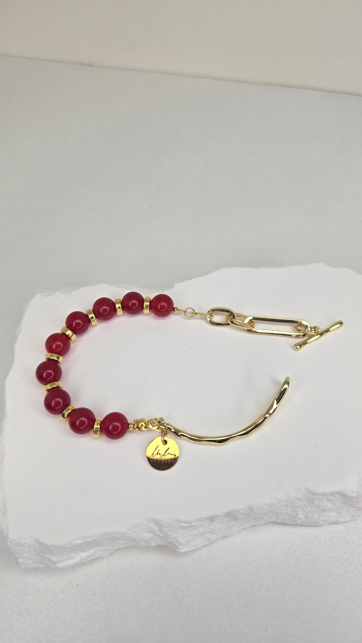 Crimson Glow Bracelet with red jade, gold-tone spacers and a toggle clasp, view 2