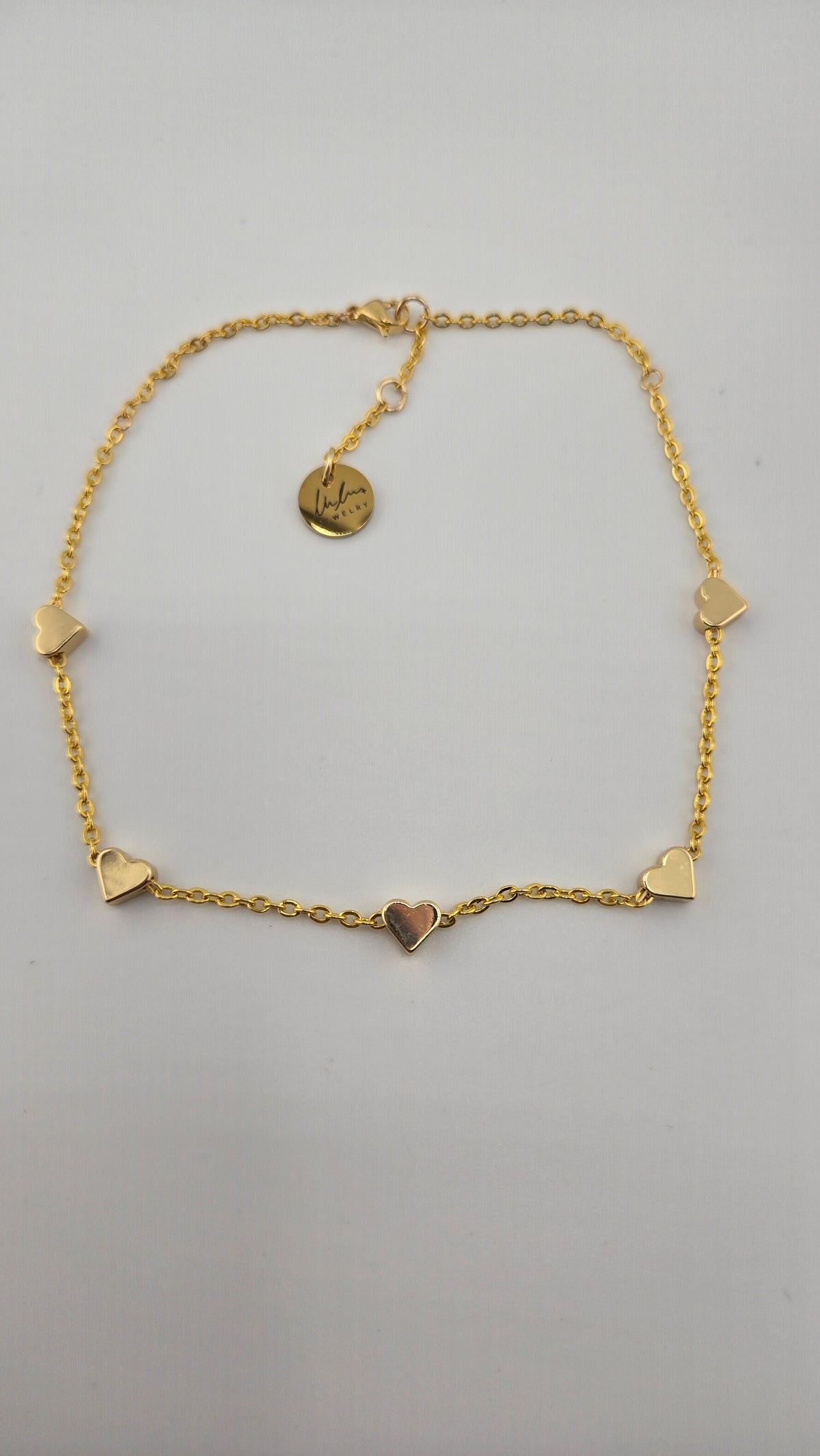 Golden Love Anklet with five polished hearts on a fine gold-tone chain, view 2