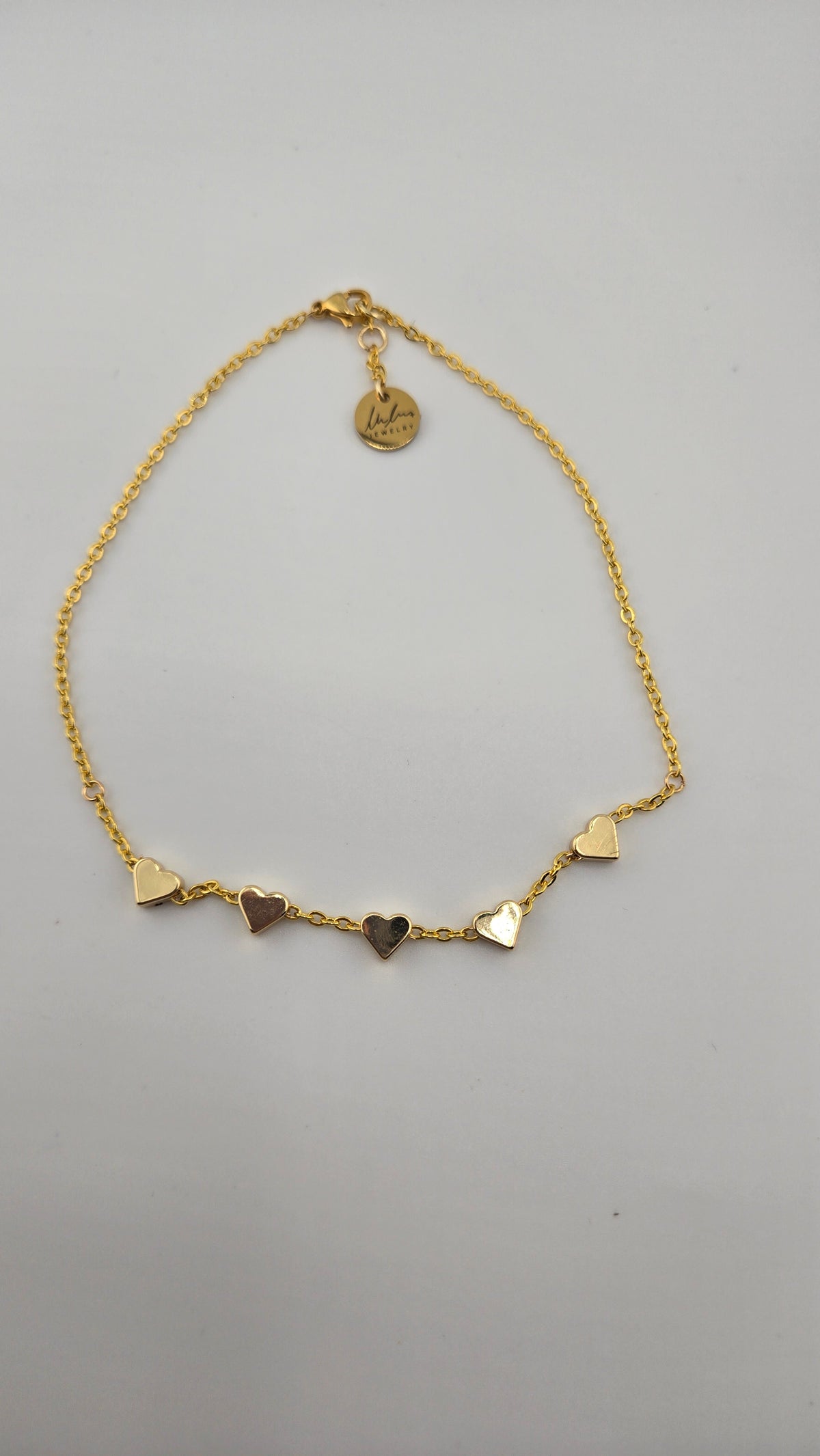 Sweetheart Anklet with five polished heart charms on a fine gold-tone chain