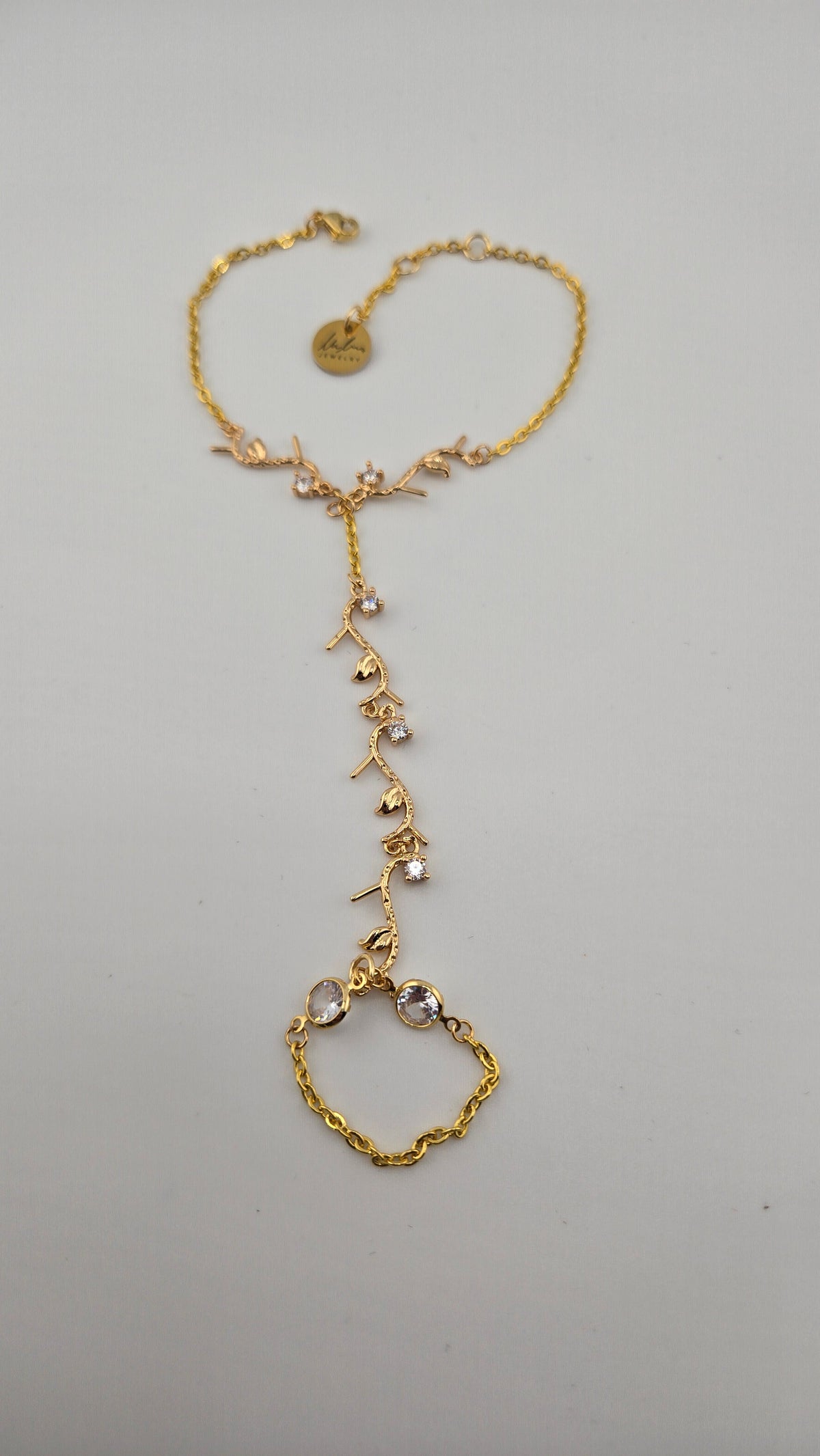 Golden Garden Hand Chain with gold-tone vine branches and sparkling stones