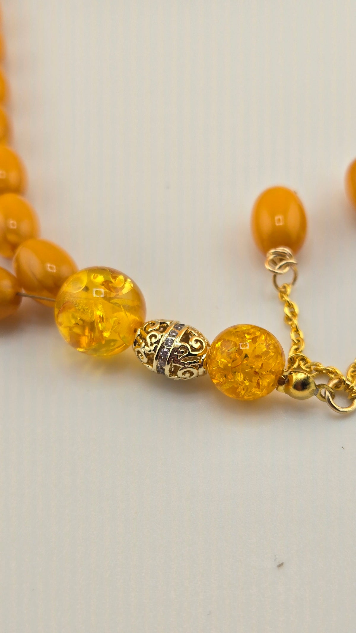 Golden Honey Tasbih with amber and honey-toned beads and ornate gold-tone spacers, view 10