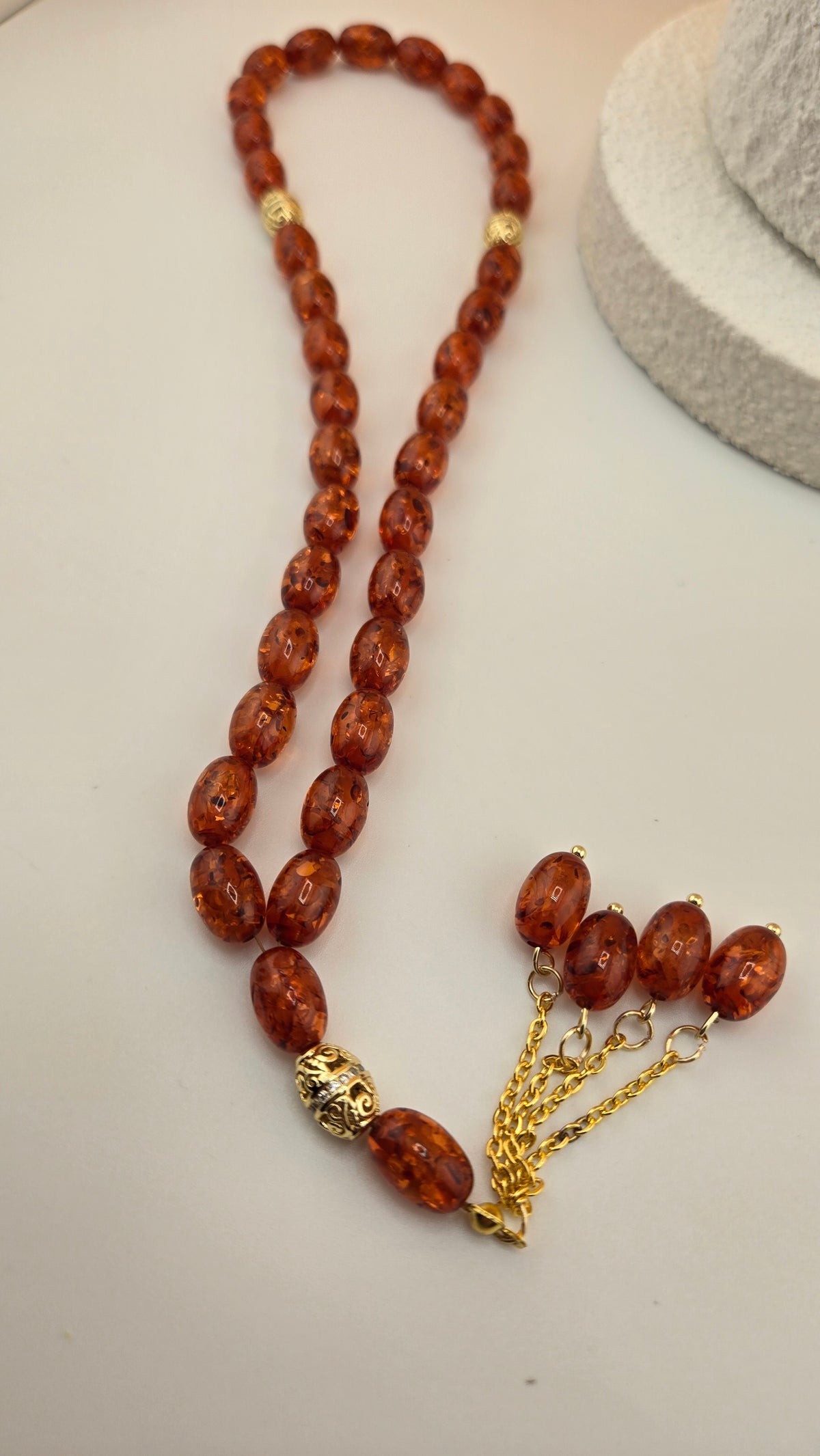 Golden Honey Tasbih with amber and honey-toned beads and ornate gold-tone spacers, view 3