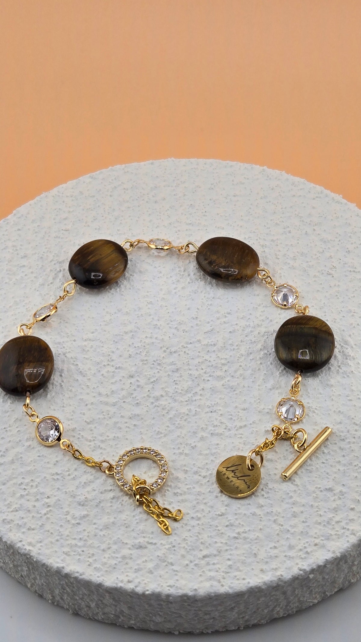Tiger Eye Luxe Bracelet with brown tiger eye beads and dangling gold-tone charms, view 2
