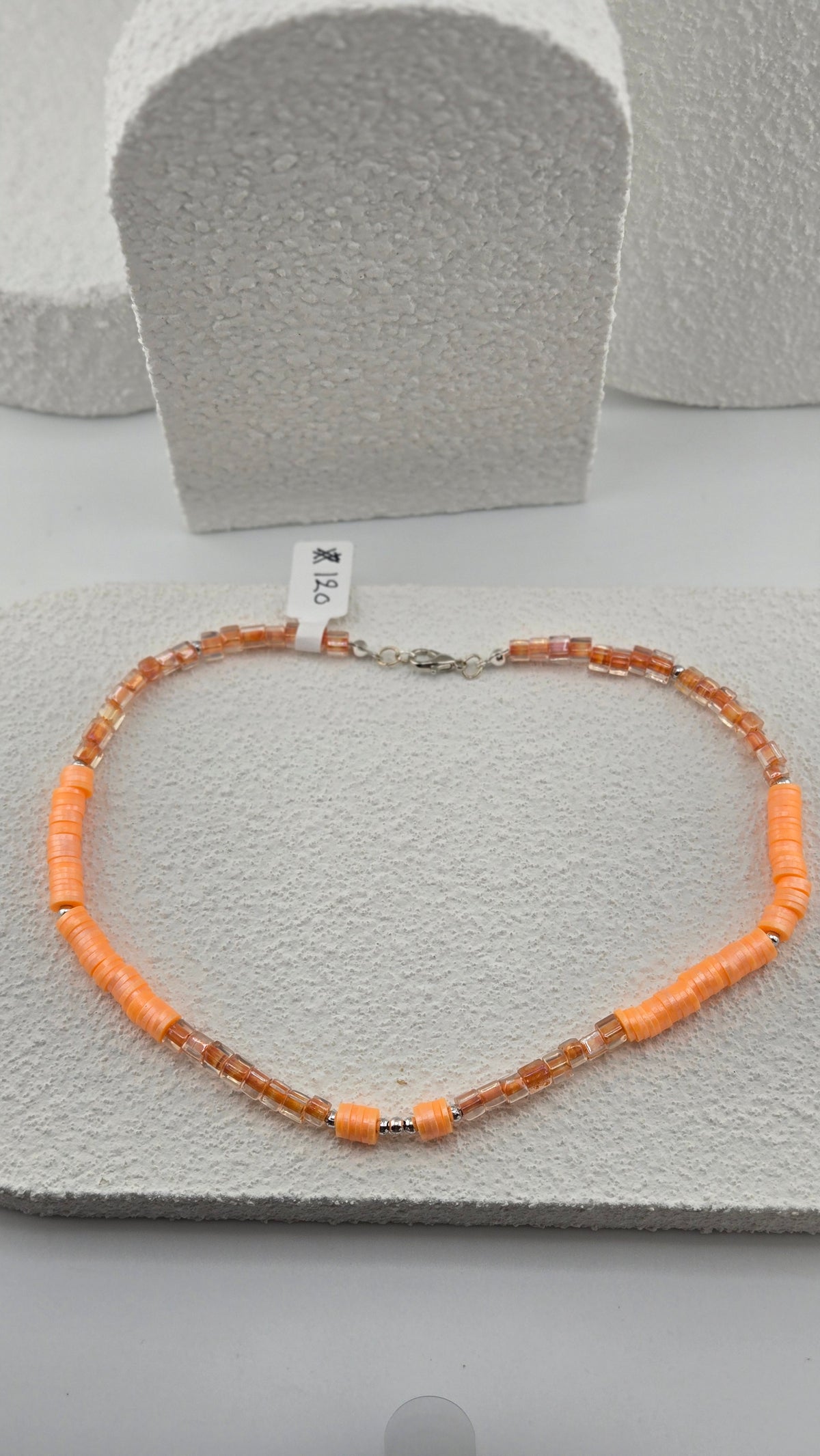 Apricot Glow Necklace, full view with silver-tone lobster clasp and clusters of apricot-orange disc beads, view 2