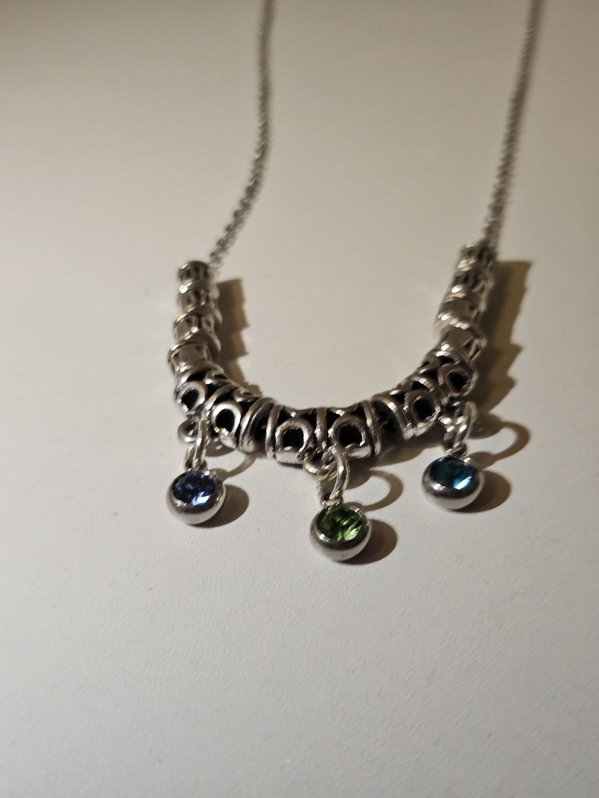 Drops of Dawn Blue Accent Necklace with blue-green drops on an ornate silver-tone chain, view 4