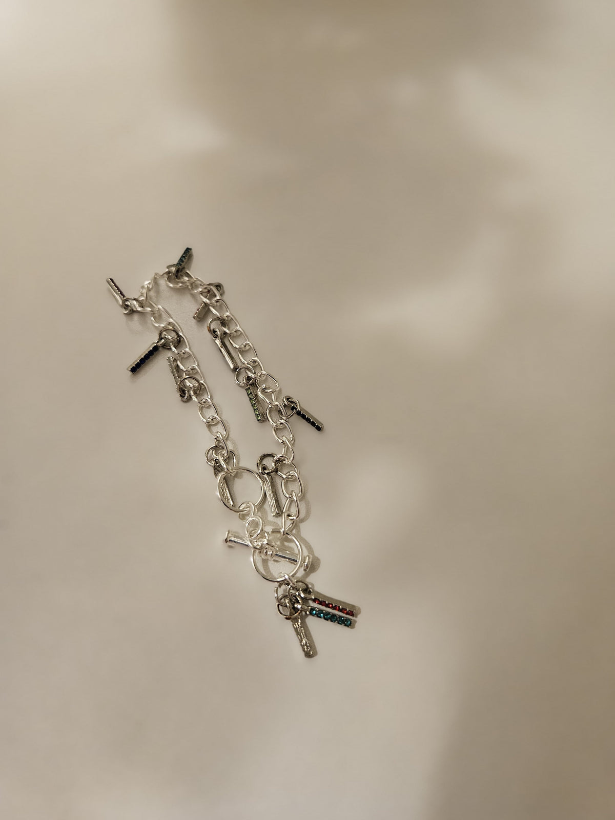 Chain Glow Silver-Tone Bracelet with oval links and dangling dark accents, view 2