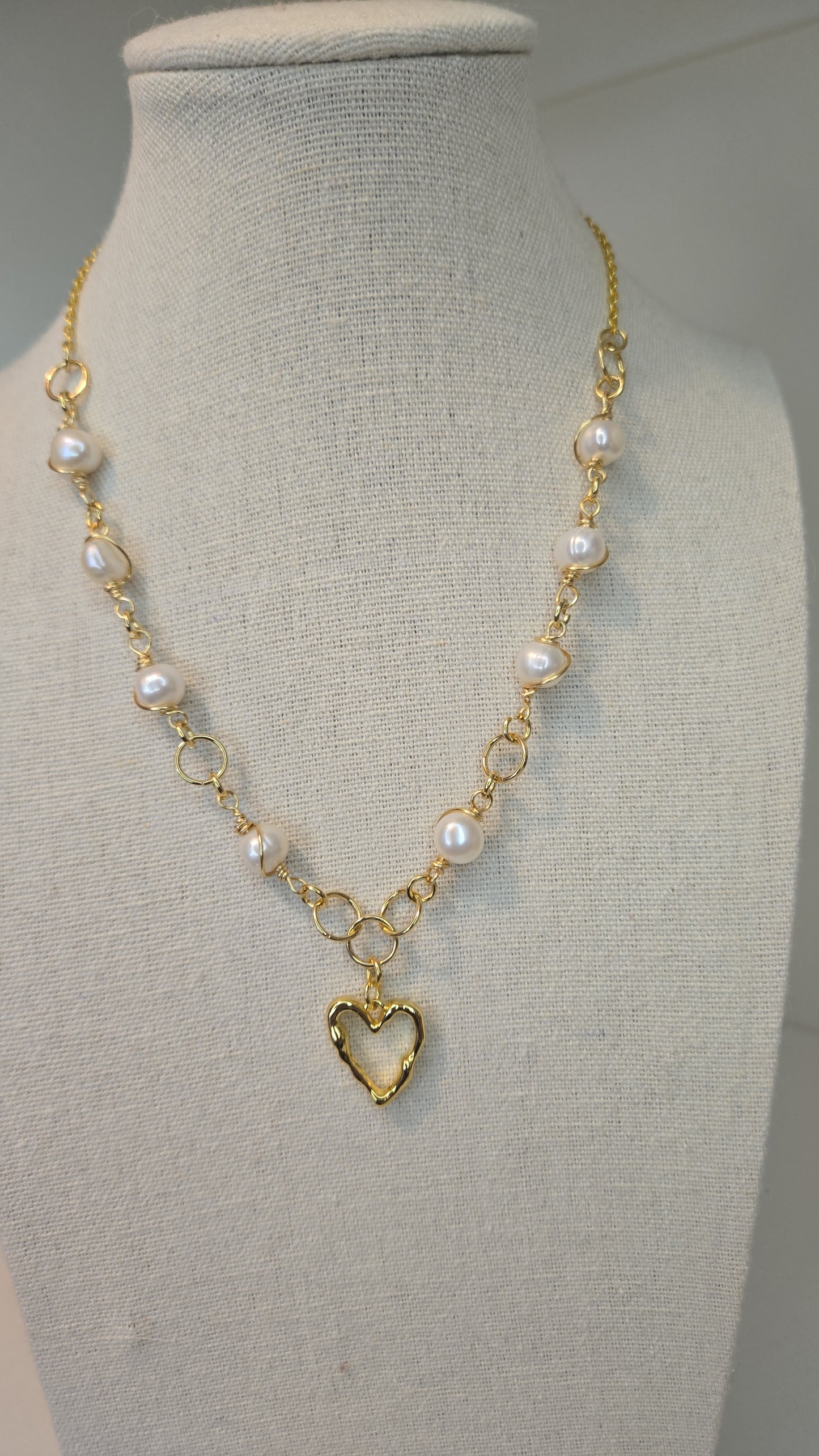 Model wearing Sacred Heart Charm Bracelet on wrist, showcasing its elegance