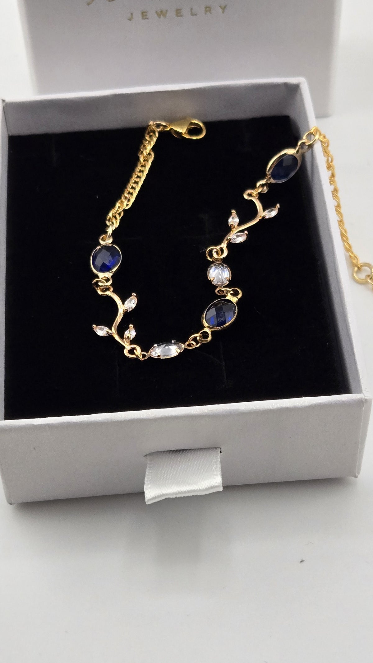 Navy Ivy Bracelet, close view of the ivy branch links and navy stones, view 3