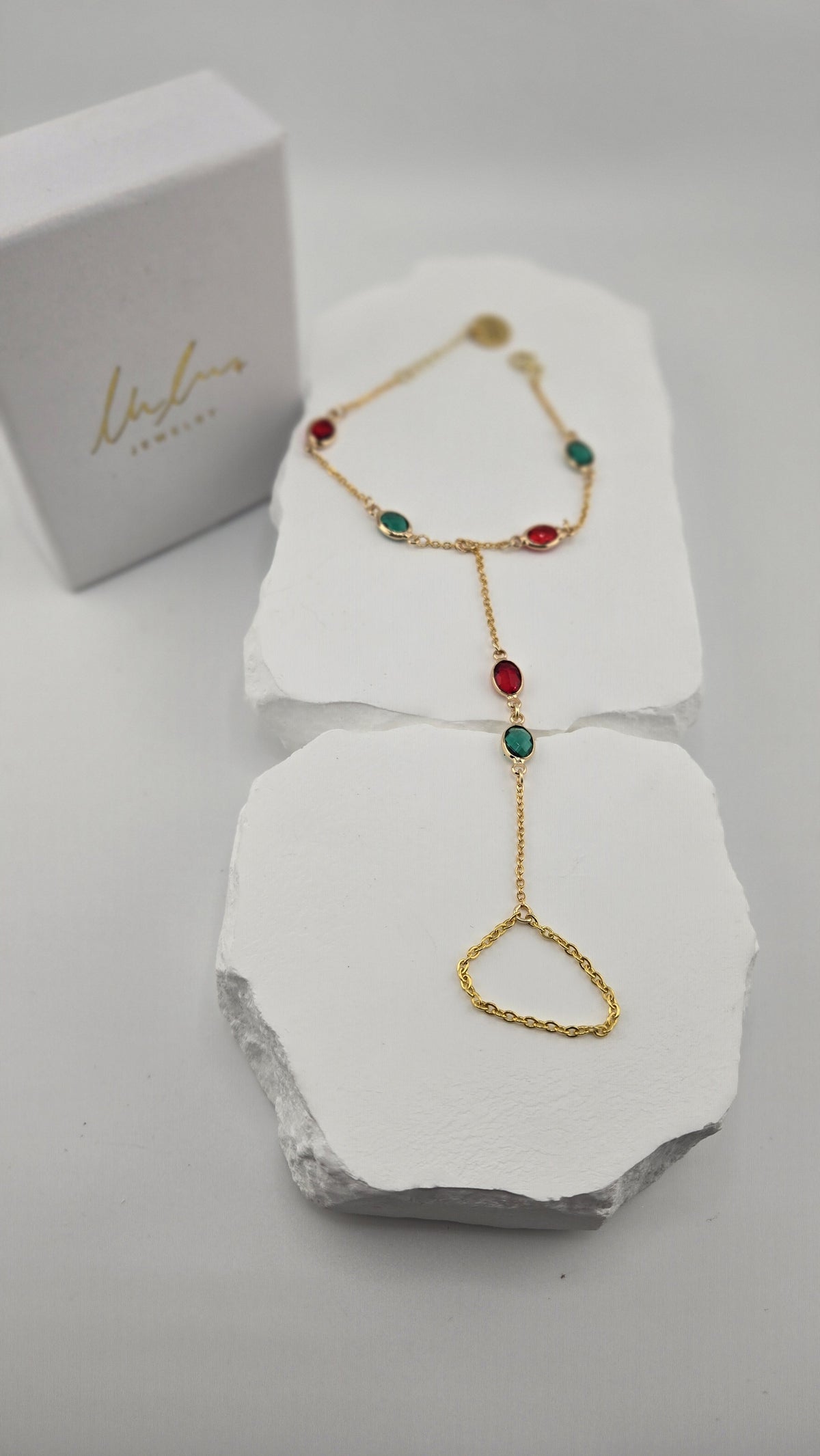 Sultana Hand Chain full length on white stone