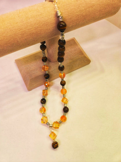 Tiger Glow Necklace with amber-hued crystals, brown beads and a double pendant, view 8
