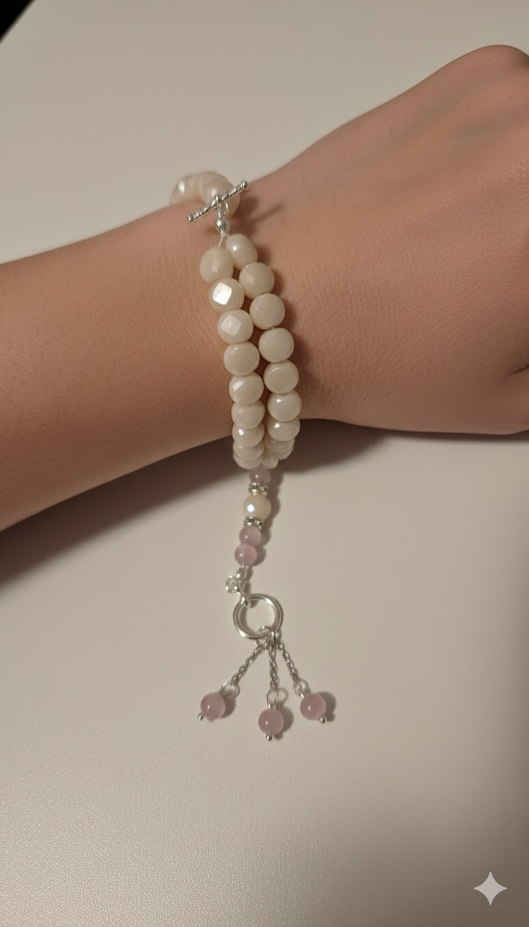 Close-up view of vibrant rose quartz beads in the tasbih