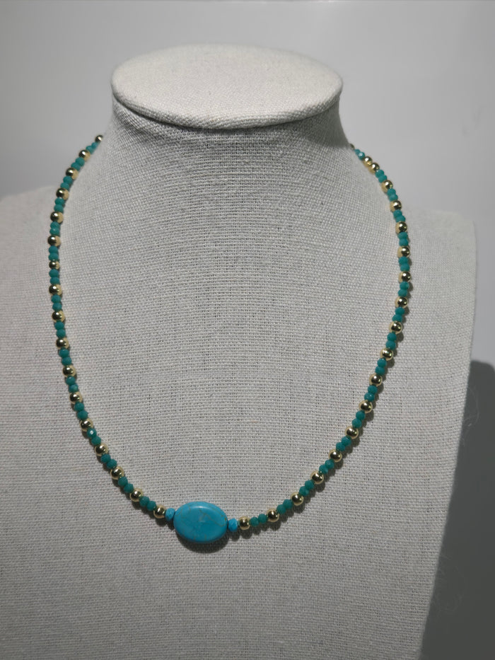 Turquoise Accent Beaded Necklace with turquoise-colored centerpiece and gold-tone details