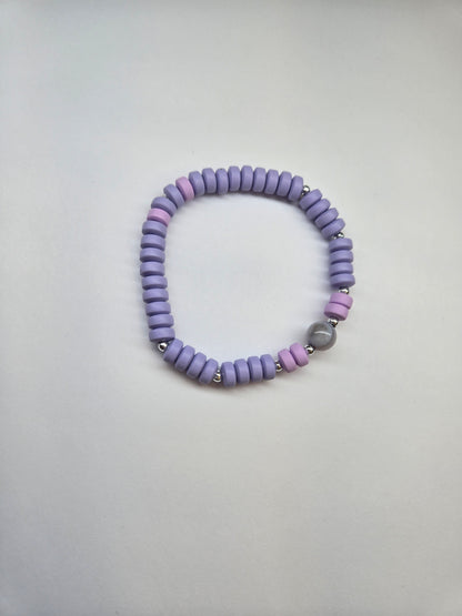 Minimalist Heishi Bead Bracelet with purple and pink heishi beads and a round stone bead, view 2