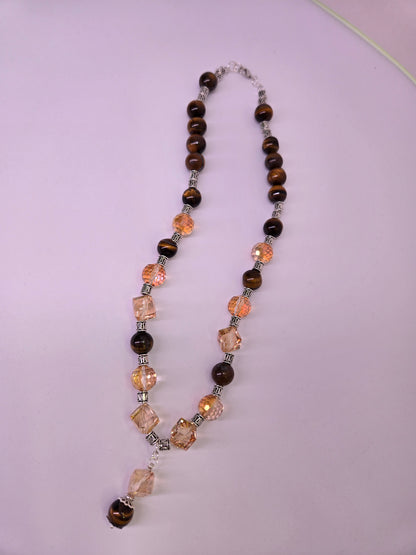 Tiger Glow Necklace with amber-hued crystals, brown beads and a double pendant