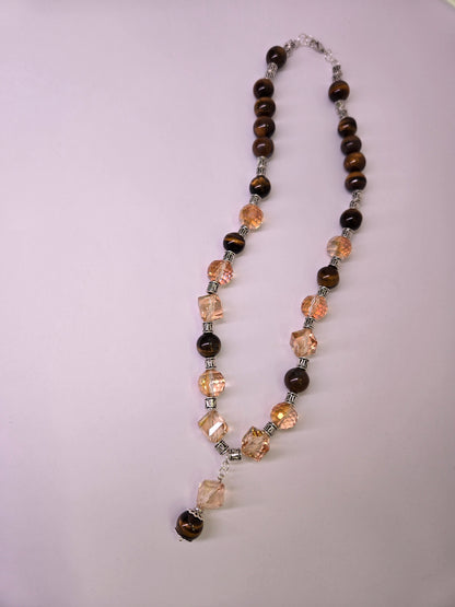 Tiger Glow Necklace with amber-hued crystals, brown beads and a double pendant, view 2