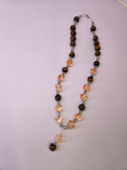Tiger Glow Necklace with amber-hued crystals, brown beads and a double pendant, view 3