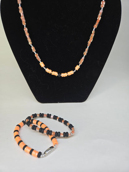 Orange Pulse Beaded Jewelry necklace and two bracelets in orange and black beads, view 3