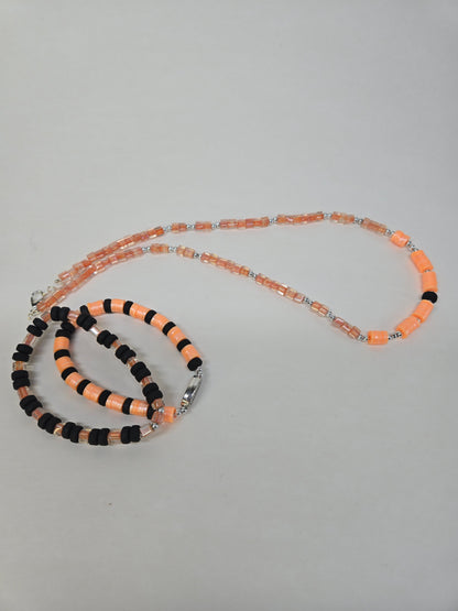 Orange Pulse Beaded Jewelry necklace and two bracelets in orange and black beads, view 7