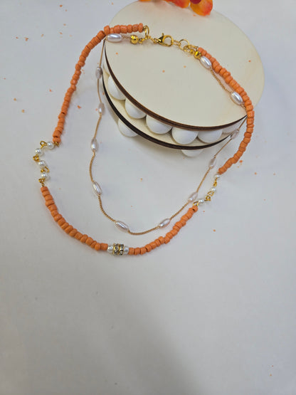 Sunset Pearl Orange Beaded Necklace with orange chip beads and white accents, view 2
