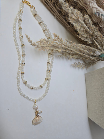 Sea Pearl Necklace with two layers of white beads, gold-tone accents and a shell charm