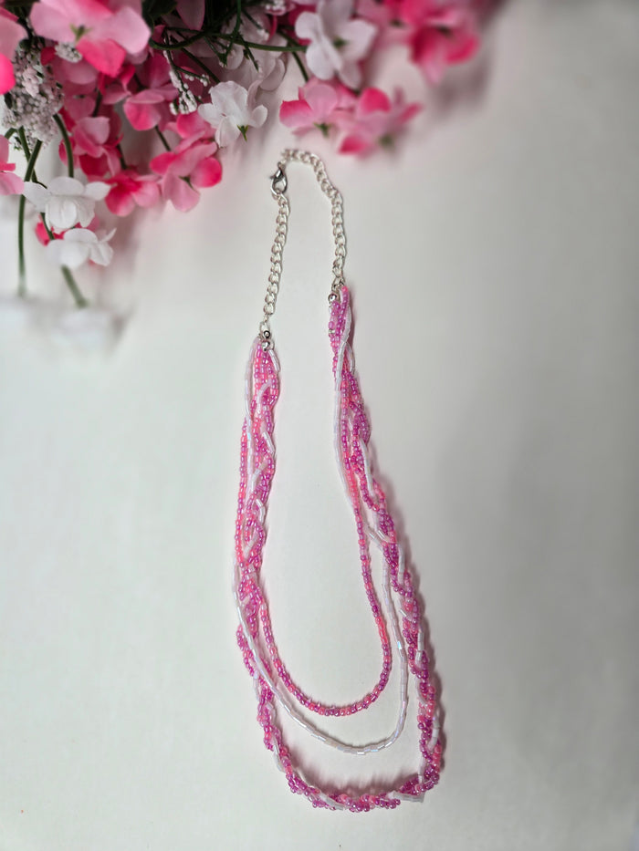 Rosy Whisper Necklace with pink braided beadwork on an adjustable silver chain