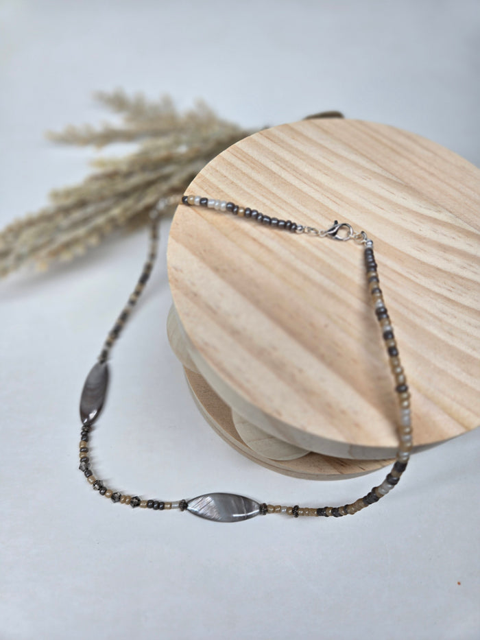 Desert Stone Necklace with beige and gray stone beads and metallic accents