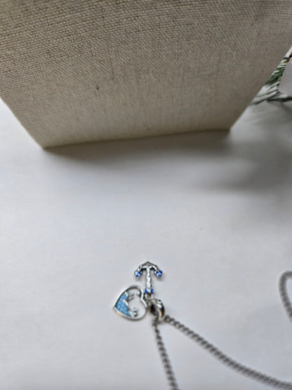 Soul Anchor Charm Necklace with anchor and open-heart charms on a stainless steel chain, view 4